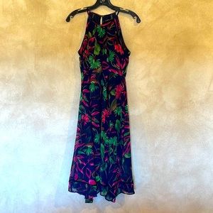Small dress in navy with pink flowers and green leaves. Flowy skirt, fitted too.